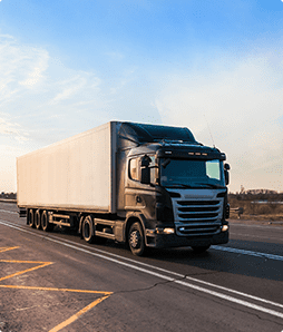 black-truck-moving-city-s-suburb